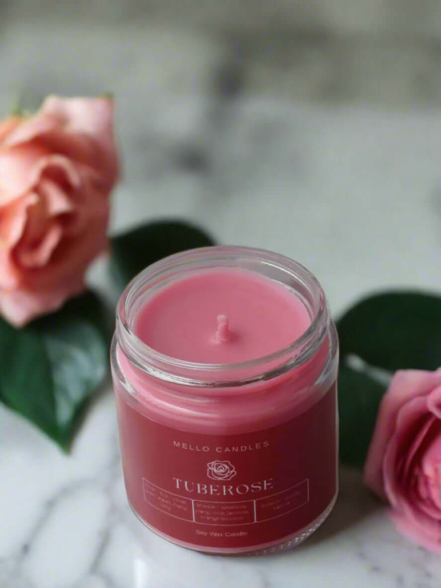 Mello Tuberose candle on table with elegant home decor, floral and musky aroma.