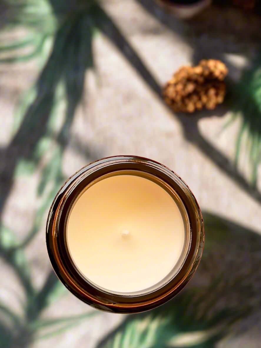 Flat-lay of Lavrosille Essence soy candle – lavender, vanilla and rose fragrance in glass jar.