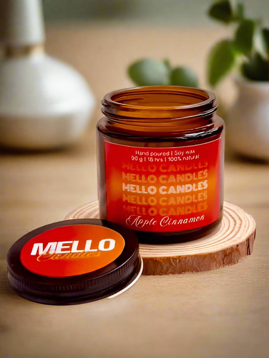 Apple Cinnamon soy candles in glass jars placed on wooden table – warm and festive home fragrance