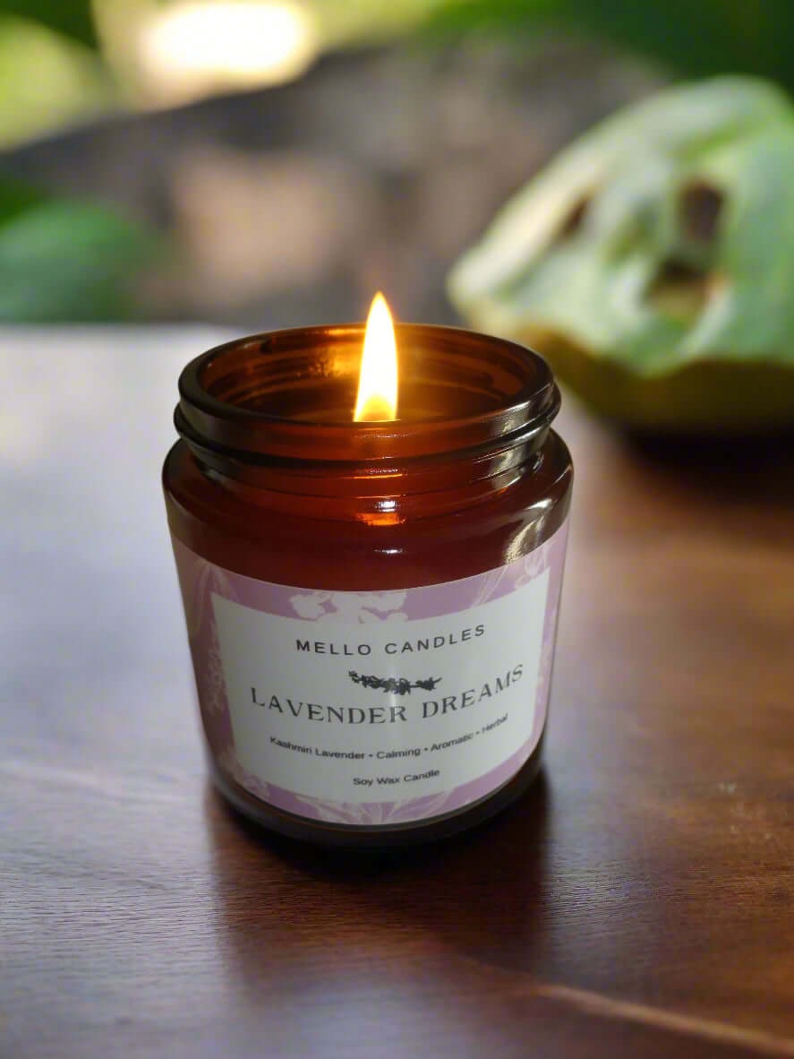 Natural soy candle in glass jar – Lavender Dreams scent burning candle on rustic wooden surface