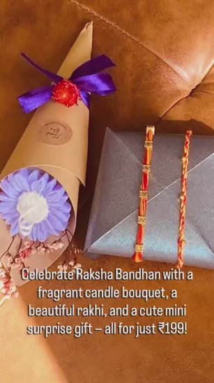 A video that shows mini rakhi hamper with a candle bouquet and candies with a small gift